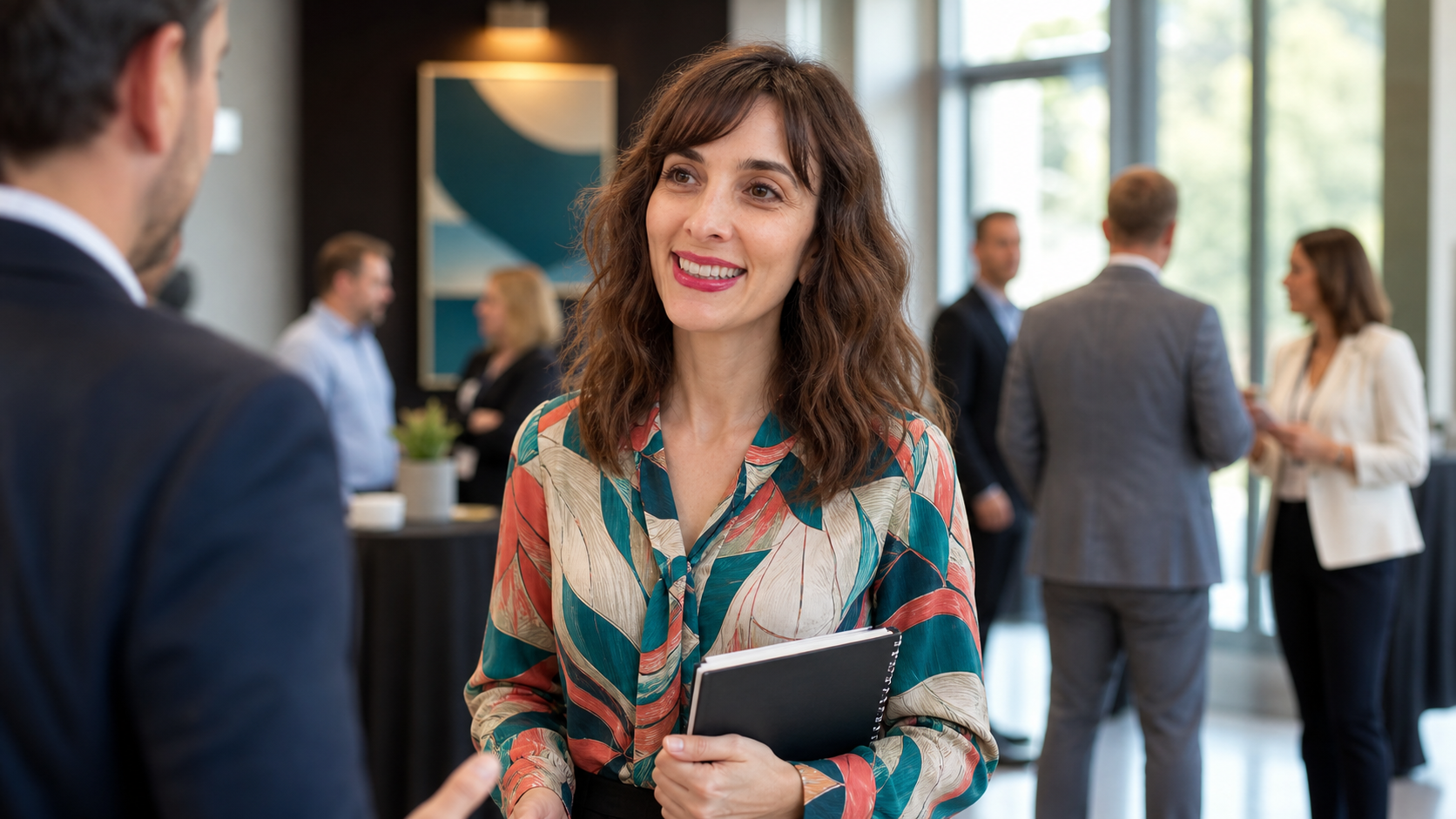 Josette Perrone in a healthcare conference lobby conversation